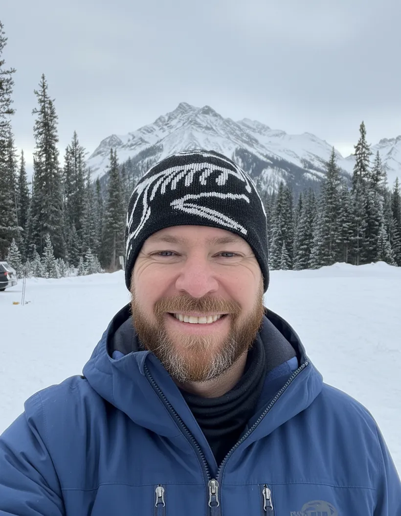 Andy Carey skiing in the mountains